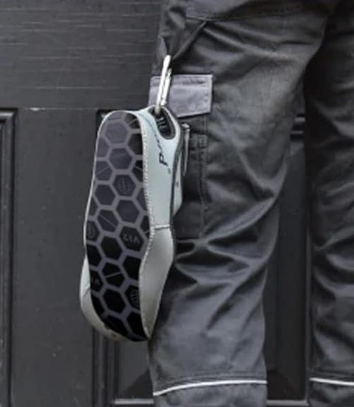 Image of Overshoes being hung on Carabiner